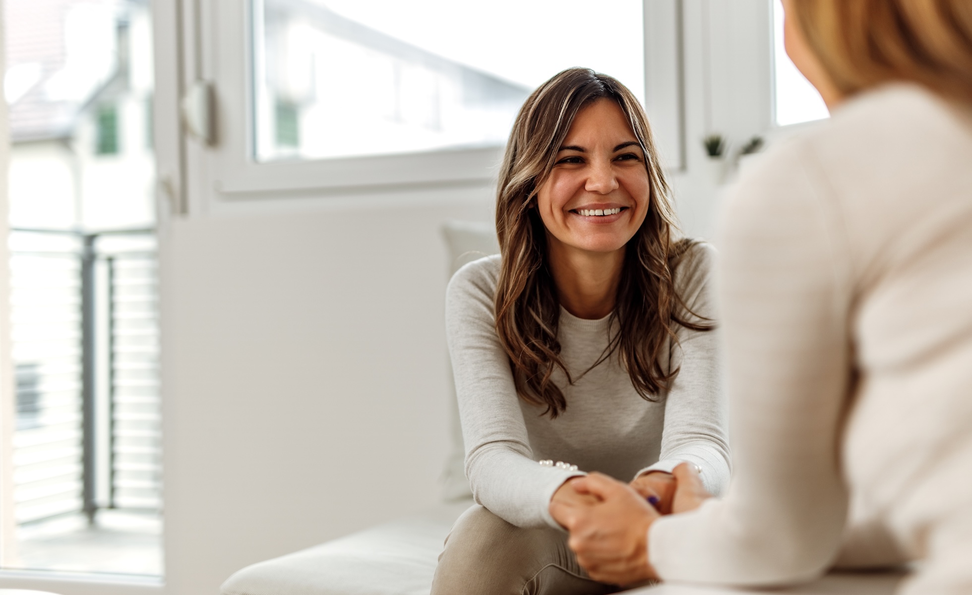Physician holding hand of patient